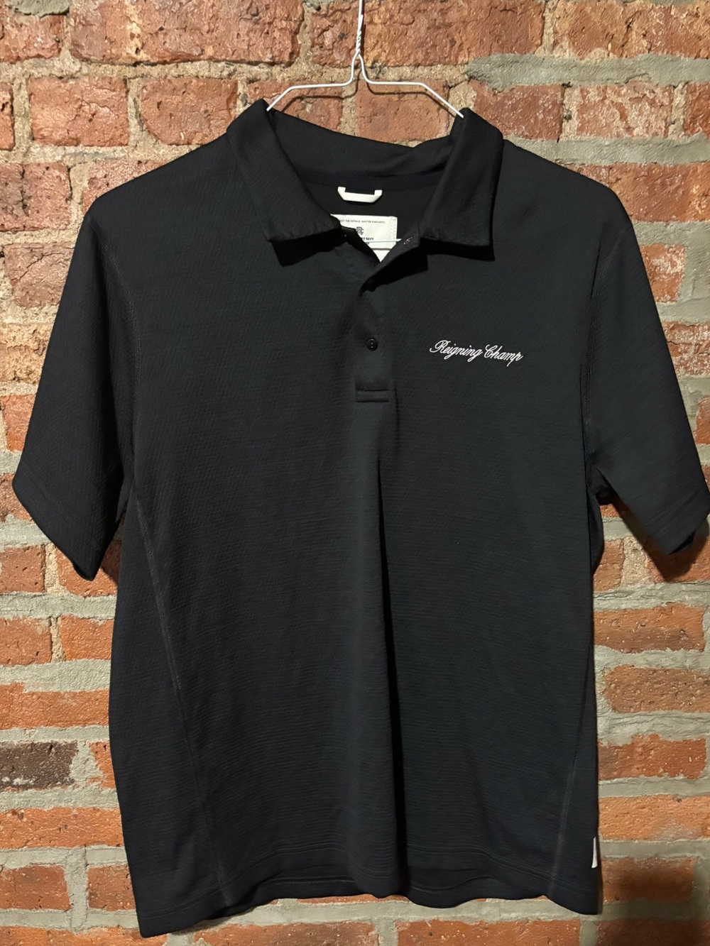 Reigning Champ men’s snap button stretch polo shirt, size L